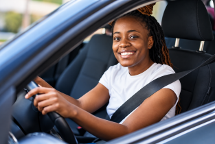 Smiling Driver in a Modern Car